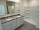 Double vanity bathroom with shower and granite at 2453 Shiprock Ct, Deltona, FL 32738