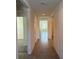 Spacious hallway with tile floors leading to other rooms at 2453 Shiprock Ct, Deltona, FL 32738