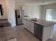 Kitchen features granite countertops, stainless steel appliances, and an island at 2453 Shiprock Ct, Deltona, FL 32738