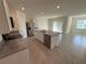 Open kitchen with granite countertops and stainless steel appliances at 2453 Shiprock Ct, Deltona, FL 32738