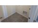 Laundry room with tile floor and built-in shelving at 2453 Shiprock Ct, Deltona, FL 32738