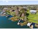 Aerial view of the waterfront property showing the boat dock and lush green landscaping at 128 W Juliana Way, Auburndale, FL 33823