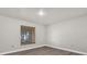 Neutral bedroom featuring a window with natural light, and wood floors at 128 W Juliana Way, Auburndale, FL 33823