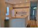 Kitchen features granite countertops and white cabinets at 13620 Waterhouse Way, Orlando, FL 32828