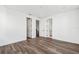 Bright bedroom with wood-look floors and access to a bathroom and hallway at 2233 Valentine Aly, Orlando, FL 32804