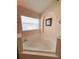 Relaxing soaking tub beneath a bright window and an art niche creates a soothing atmosphere at 2555 Oneida Loop, Kissimmee, FL 34747
