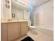 Clean bathroom with combined shower and bath and a well-lit mirror at 2555 Oneida Loop, Kissimmee, FL 34747