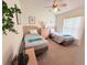 Cozy bedroom with carpet, ceiling fan, two twin beds, and a window letting in natural light at 2555 Oneida Loop, Kissimmee, FL 34747