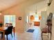 Inviting dining area with tile floors seamlessly connects to the kitchen, featuring natural light and cozy ambiance at 2555 Oneida Loop, Kissimmee, FL 34747