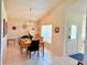 Dining room features tiled floors, a decorative chandelier, and a welcoming atmosphere for Gathering gatherings at 2555 Oneida Loop, Kissimmee, FL 34747
