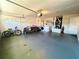 Spacious garage with laundry area, suitable for parking and storage at 2555 Oneida Loop, Kissimmee, FL 34747