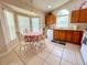 Bright kitchen nook with a dining table, light wood cabinets, and plenty of natural light for enjoyable meals at 2555 Oneida Loop, Kissimmee, FL 34747