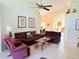 Cozy living room with comfortable seating and tile floors at 2555 Oneida Loop, Kissimmee, FL 34747