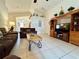 Spacious living room with tiled floors, a comfortable sofa, and entertainment center, perfect for relaxation at 2555 Oneida Loop, Kissimmee, FL 34747