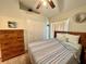 Comfortable main bedroom with queen bed, closet, and natural lighting at 2555 Oneida Loop, Kissimmee, FL 34747