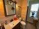 Bathroom with wood-paneled walls and a single vanity at 5021 Harbor Hts, Lady Lake, FL 32159