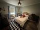 Cozy bedroom with a queen-size bed and window seat at 5021 Harbor Hts, Lady Lake, FL 32159