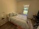 Bedroom with a queen-size bed and window at 5021 Harbor Hts, Lady Lake, FL 32159