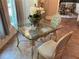 Charming breakfast nook with glass-top table and ornate chairs at 5021 Harbor Hts, Lady Lake, FL 32159