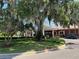 Brick community center with a welcoming entrance and landscaping at 5021 Harbor Hts, Lady Lake, FL 32159