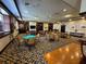 Elegant game room with tables, seating, and a bar at 5021 Harbor Hts, Lady Lake, FL 32159