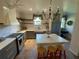 Modern kitchen with white island, gray cabinets, and a chandelier at 5021 Harbor Hts, Lady Lake, FL 32159