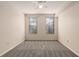 Large empty bedroom with carpet, smooth walls, ceiling fan, and two windows at 911 N Orange Ave # 408, Orlando, FL 32801