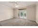 Spacious living room with a ceiling fan and a sliding glass door at 911 N Orange Ave # 408, Orlando, FL 32801