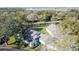 House with a gray roof and a large backyard, situated in a wooded area at 3507 Tenby Cir, Clermont, FL 34711