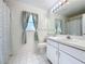 Clean bathroom with a toilet, shower, and white vanity at 3507 Tenby Cir, Clermont, FL 34711