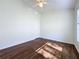 Spacious bedroom with wood-look floors and large window at 3507 Tenby Cir, Clermont, FL 34711