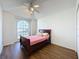 Cozy bedroom with wood-look floors and a double bed at 3507 Tenby Cir, Clermont, FL 34711