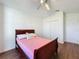 Spacious bedroom with wood-look floors and a double bed at 3507 Tenby Cir, Clermont, FL 34711