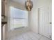 Small dining area with tile floor and a chandelier at 3507 Tenby Cir, Clermont, FL 34711