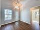 Bright and airy entryway with wood-look floors and decorative door at 3507 Tenby Cir, Clermont, FL 34711
