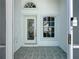 Front entrance with a decorative glass door and tiled flooring at 3507 Tenby Cir, Clermont, FL 34711
