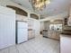 Kitchen features light wood cabinets, tile floor, and stainless steel appliances at 3507 Tenby Cir, Clermont, FL 34711