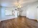 Spacious living room with kitchen view and wood-look floors at 3507 Tenby Cir, Clermont, FL 34711