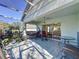 Screened patio with outdoor furniture and access to the backyard at 3507 Tenby Cir, Clermont, FL 34711