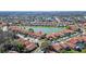 Aerial view of the community showcasing the lake and well-maintained residences at 5450 Watervista Dr, Orlando, FL 32821