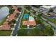 Overhead view showcasing community clubhouse, pool, and tennis courts at 5450 Watervista Dr, Orlando, FL 32821