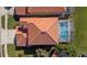 Bird's eye view of the terra cotta roof and screened in pool at 5450 Watervista Dr, Orlando, FL 32821