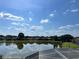 A beautiful backyard lake view with clear skies reflecting on the water's surface at 5450 Watervista Dr, Orlando, FL 32821