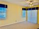 Bright bedroom features three windows and neutral carpet at 5450 Watervista Dr, Orlando, FL 32821