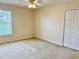 Cozy bedroom with neutral walls, closet, and a window, creating a serene and inviting atmosphere at 5450 Watervista Dr, Orlando, FL 32821
