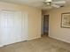 Neutral bedroom featuring a ceiling fan and a large closet for ample storage at 5450 Watervista Dr, Orlando, FL 32821