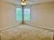 Comfortable bedroom featuring corner windows that flood the room with natural light, creating a bright and inviting space at 5450 Watervista Dr, Orlando, FL 32821