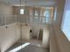 Spacious home interior with a view of the entry, stairs, and living room at 5450 Watervista Dr, Orlando, FL 32821