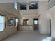 Spacious living room with high ceilings and a pass-through to the kitchen area at 5450 Watervista Dr, Orlando, FL 32821