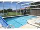 Enclosed pool with a blue finish offers a relaxing outdoor living space with a beautiful view at 5450 Watervista Dr, Orlando, FL 32821